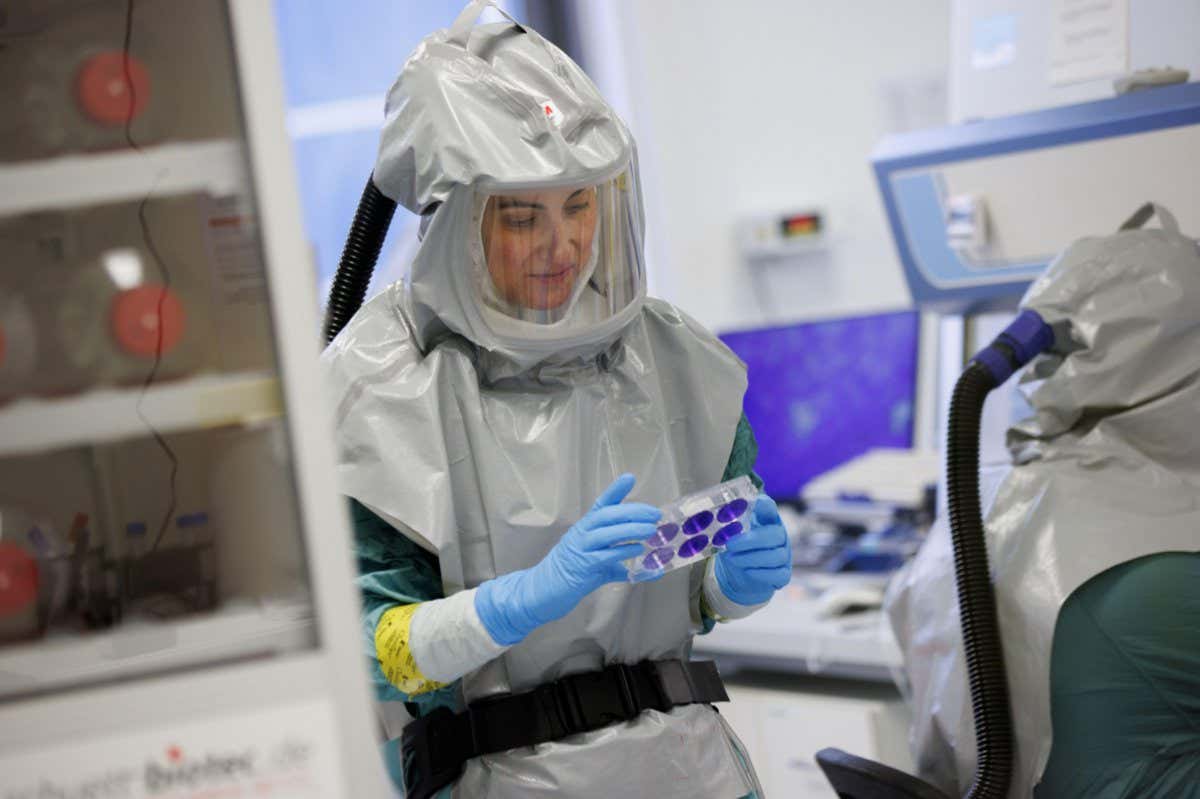 A biologist at Valneva works on its covid-19 vaccine