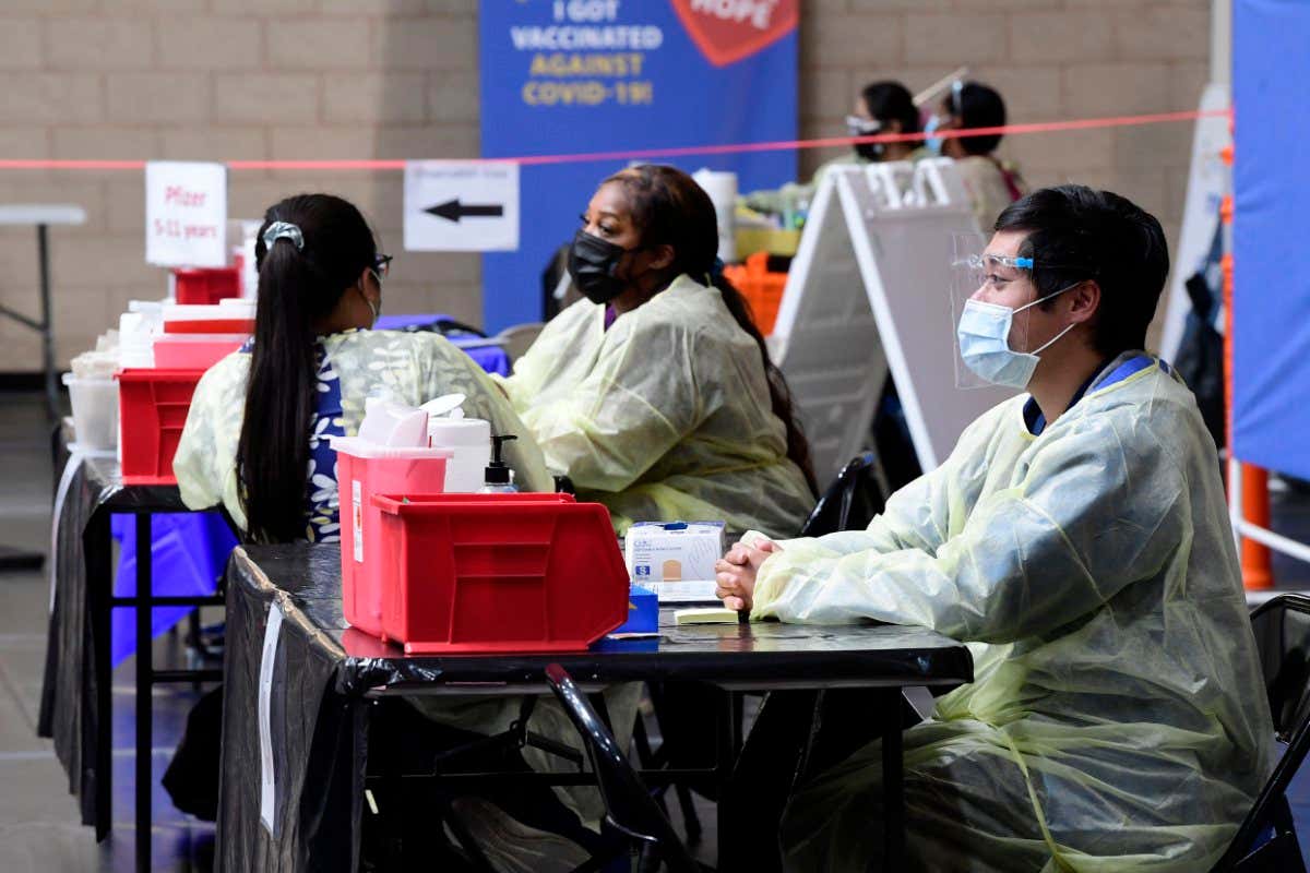 Nurses wait to administer covid-19 vaccines in Fontana, California, in the UK on 22 March