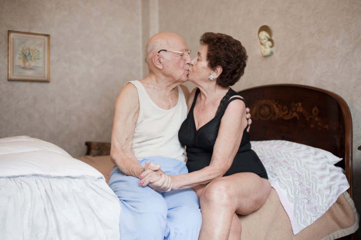 An older couple kissing