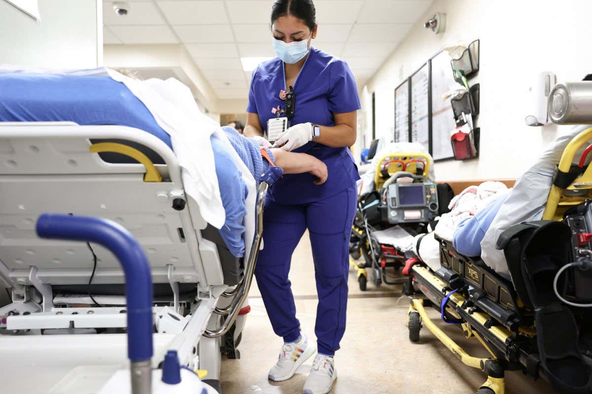 A lab technician cares for someone in the emergency department at Providence St. Mary Medical Center in Apple Valley, California, in the US on 11 March