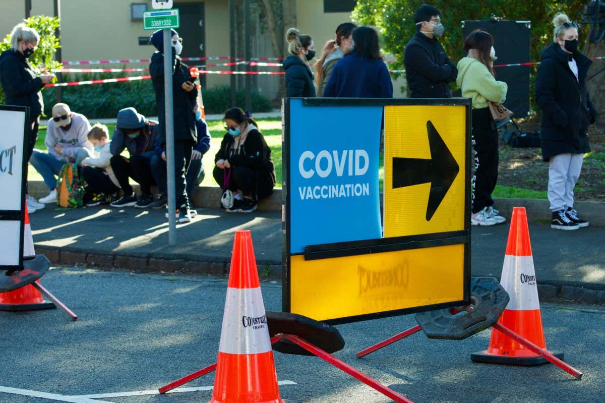 Melbourne, Victoria, Australia, August 30 2021: Covid vaccination sign. Queues of people waiting to get coronavirus vaccine outside Peanut Farm St Kilda walk-in covid-19 vaccination clinic. ; Shutterstock ID 2032774577; purchase_order: NS online; job: Photo; client: NS; other: