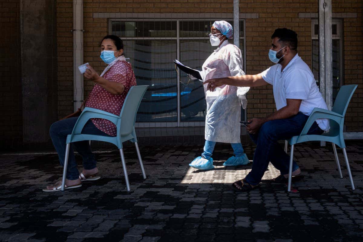 People queue for a PCR covid-19 test in Johannesburg, South Africa, on 30 November 2021