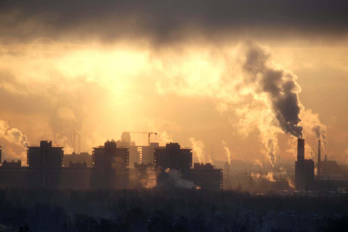 Color photograph of industrial buildings at sunset sky; Shutterstock ID 71432056; purchase_order: -; job: -; client: -; other: -