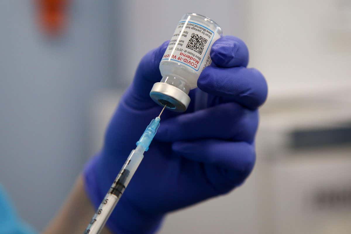 A Moderna covid-19 booster jab is prepared at a vaccination site in London in April 2022