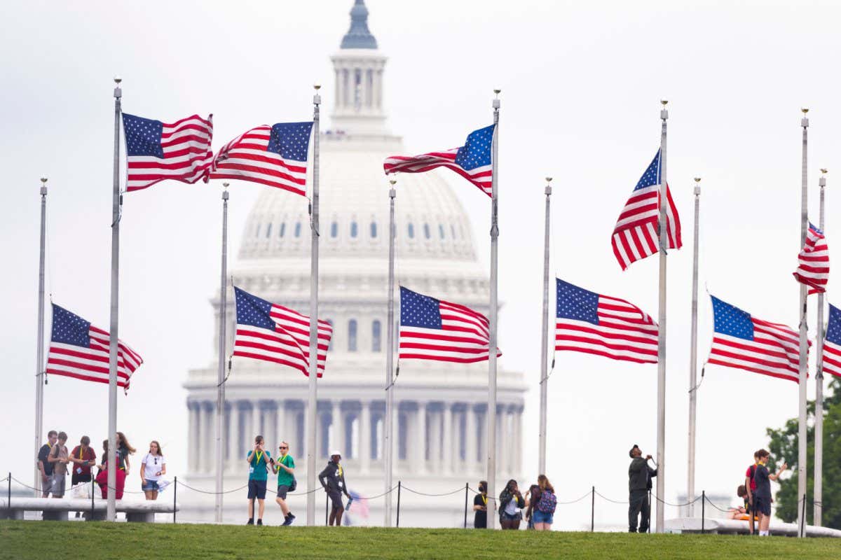 American flags on the National Mall in Washington, D.C., are lowered to half-mast to mark 1 million covid-19 deaths in the US