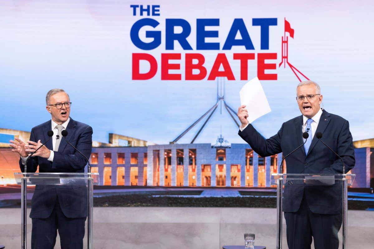 SYDNEY, AUSTRALIA - MAY 08: (L-R) Australian opposition leader Anthony Albanese and Australian Prime Minister Scott Morrison debate on live television ahead of the federal election, during the second leaders' debate of the 2022 federal election campaign at the Nine studio on May 8, 2022 in Sydney, Australia. The Australian federal election will be held on Saturday 21 May with Liberal leader Scott Morrison looking to secure a fourth term in power for the Coalition against Labor and opposition leader Anthony Albanese. (Photo by Alex Ellinghausen - Pool/Getty Images)