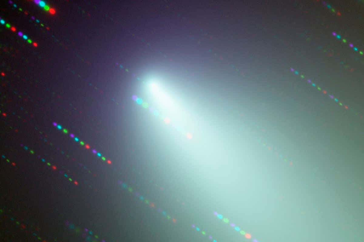 Image of the broken fragments surrounding Fragment B of Comet 73P/Schwassmann-Wachmann 3 observed with FORS1 on ESO's VLT in four filters (B, V, R, and I). As the telescope was tracking the comet, the stars appear as coloured trails, indicating the order in which the comet was observed in the different filters. North is up and East is to the left.