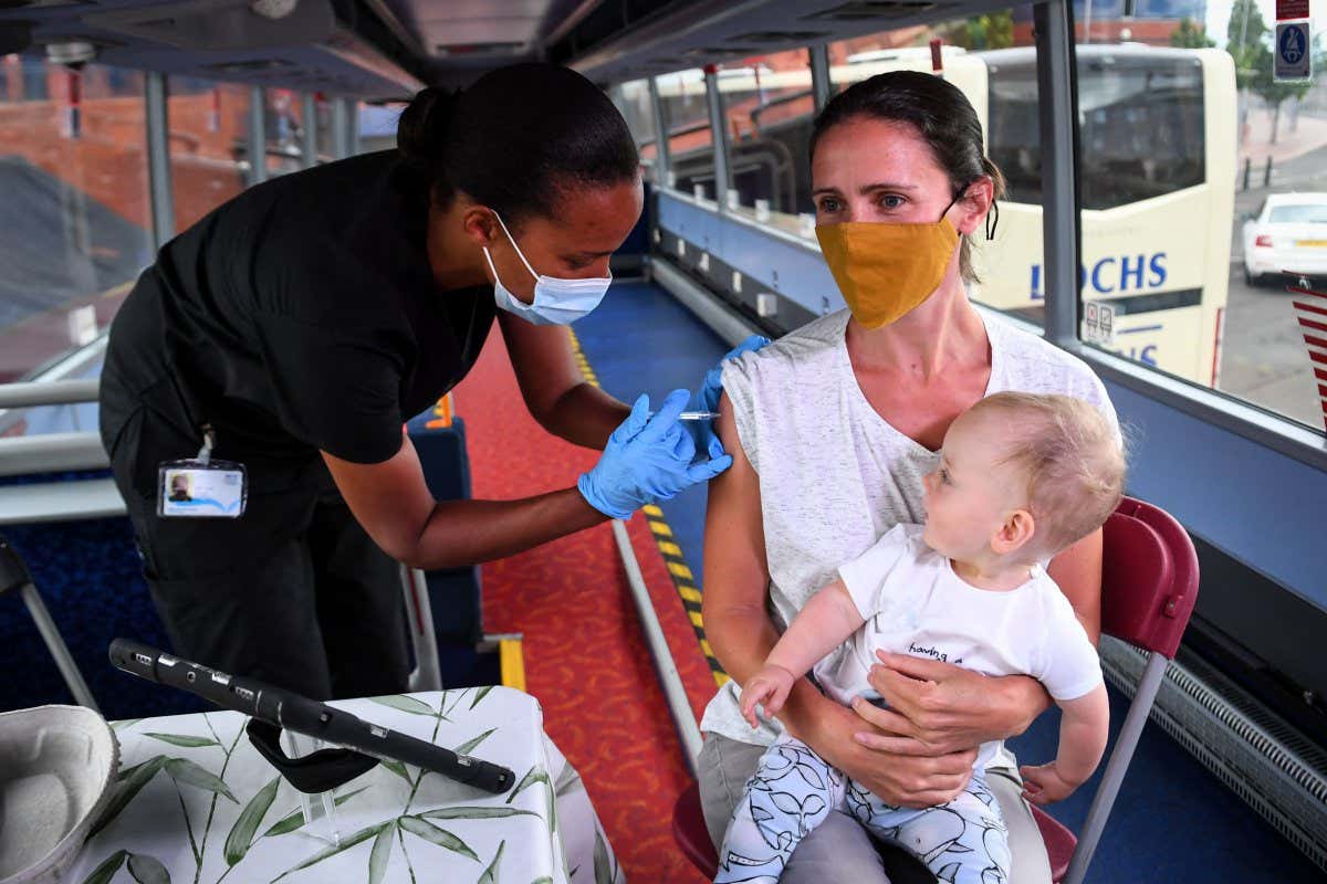 A person receives a covid-19 vaccine in Glasgow, Scotland, in July 2021