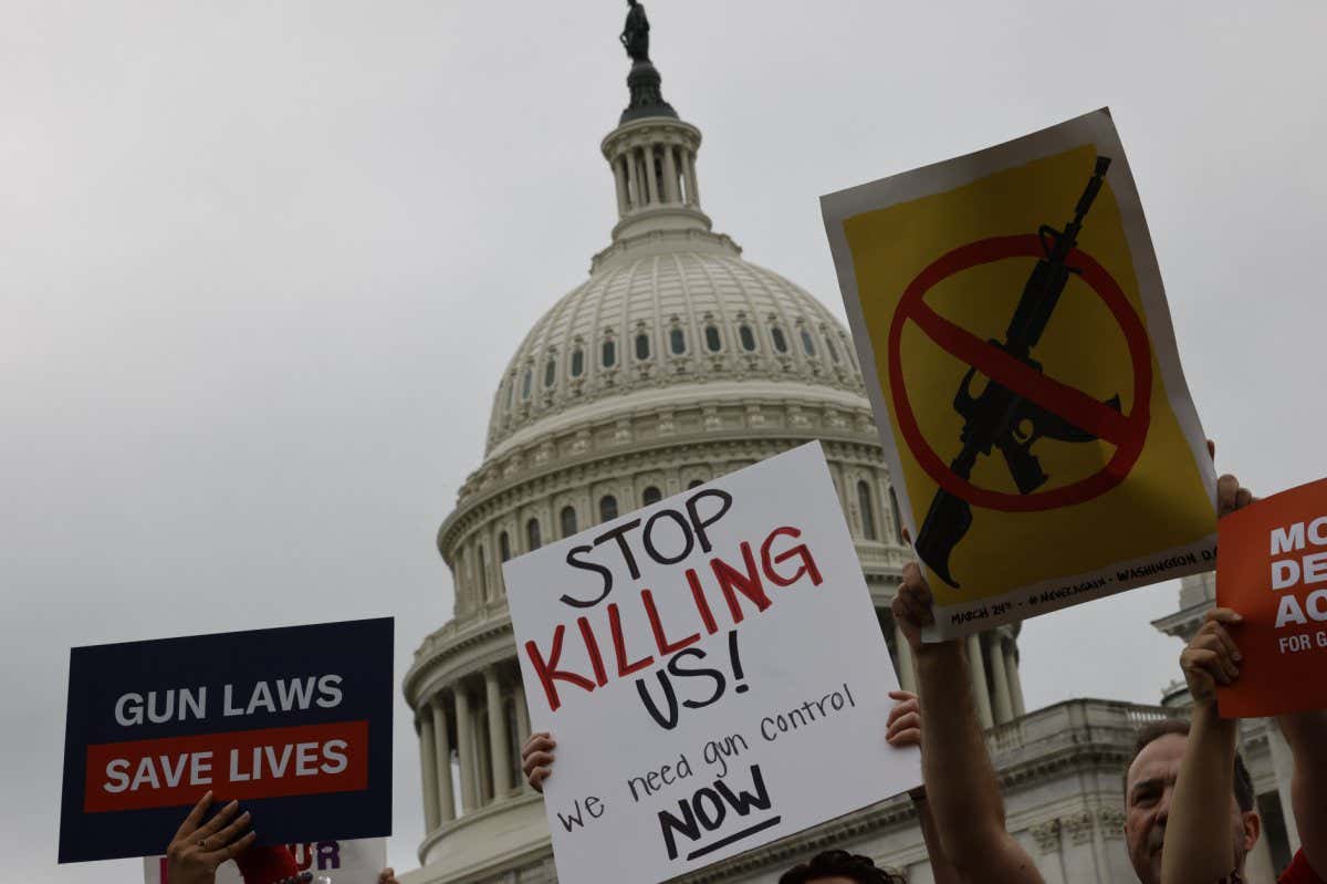 Demonstrators during a rally calling for action on gun safety on Capitol Hill in Washington, D.C., US, on Thursday, May 26, 2022.??In the wake of the school shooting in Uvalde, Texas, in which 19 students and two teachers were killed, students across the country are once again planning to walk out as a form of political action against gun violence.??Photographer: Ting Shen/Bloomberg via Getty Images