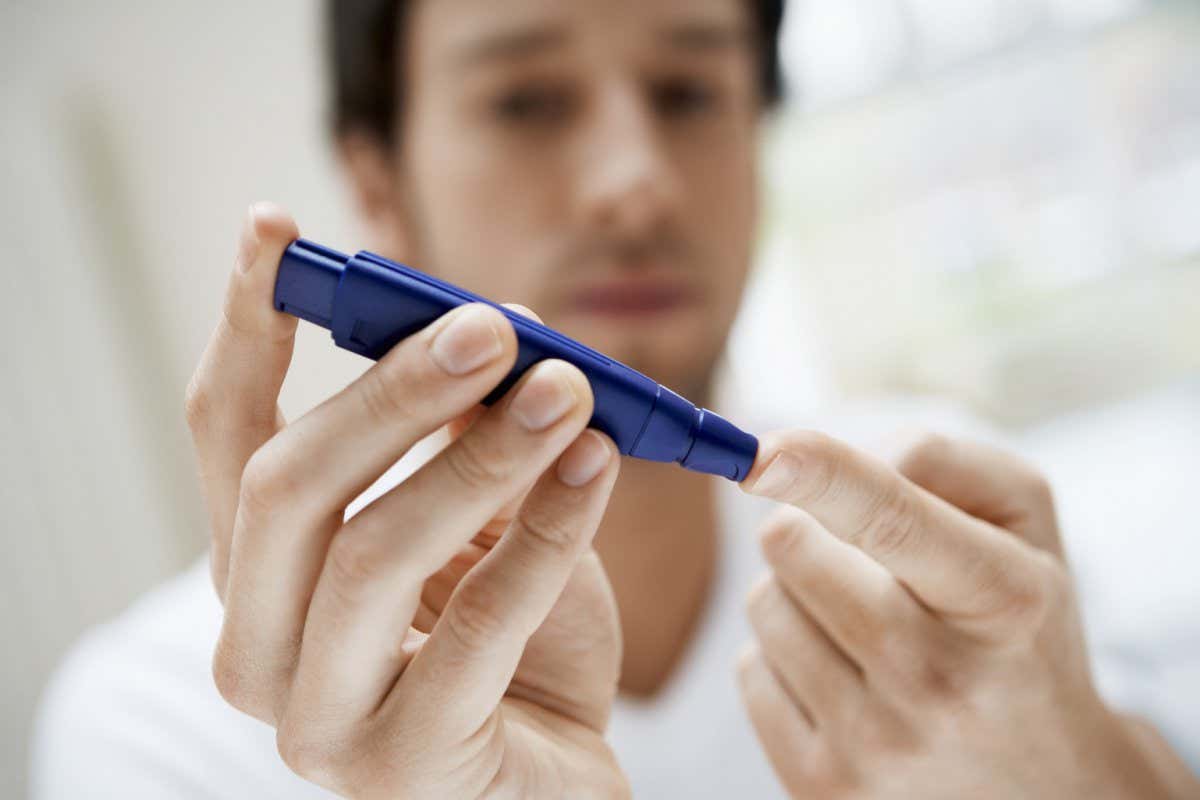 A stock image of a person testing their blood sugar level