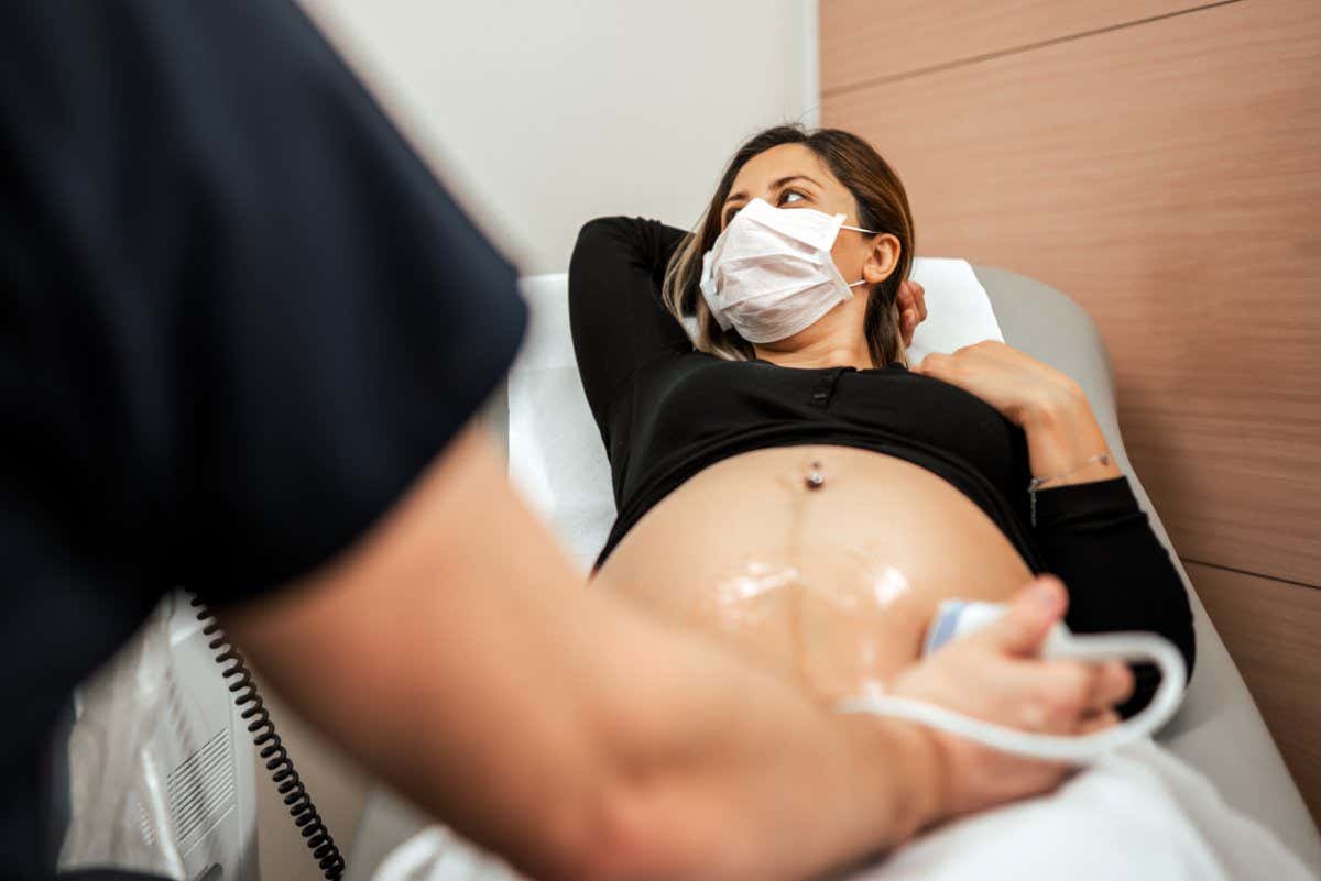 A pregnant person having an ultrasound scan in 2020