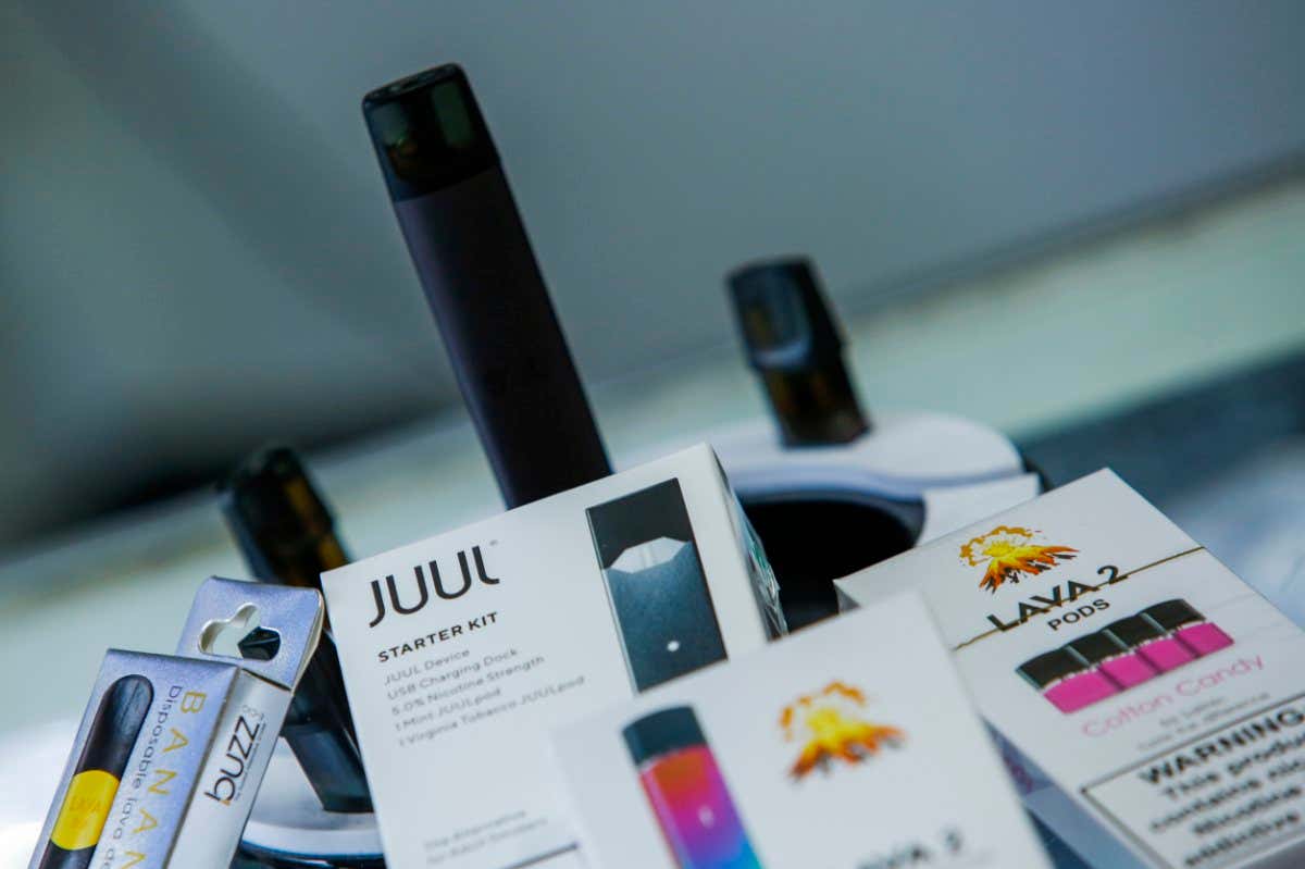 JERSEY CITY, NJ - JANUARY 02: E-cigarettes devices are display in a local store on January 2, 2020 in Jersey City, New Jersey. The Trump administration will announce this week the ban for mint-, fruit- and dessert-flavored e-cigarette cartridges, but allow menthol and tobacco flavors to remain on the market. Flavored liquid nicotine used in open tank systems can continue to be sold. (Photo by Eduardo Munoz Alvarez/Getty Images)