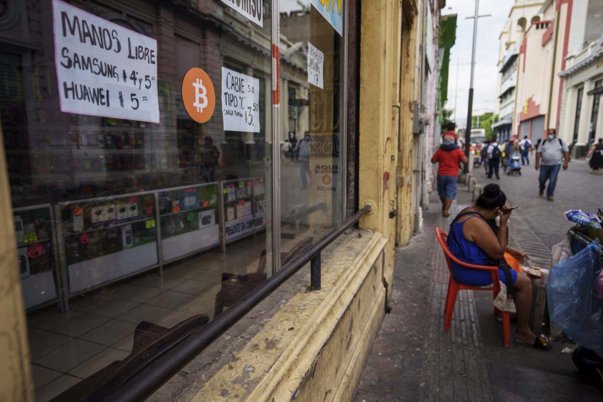 Mandatory Credit: Photo by Moises Castillo/AP/Shutterstock (12786687d) Bitcoin sign is displayed on the window of a cell phone store in San Salvador, El Salvador, . The government of El Salvador on Monday rejected a recommendation by the International Monetary Fund to drop Bitcoin as legal tender in the Central American country Bitcoin, San Salvador, El Salvador - 02 Feb 2022