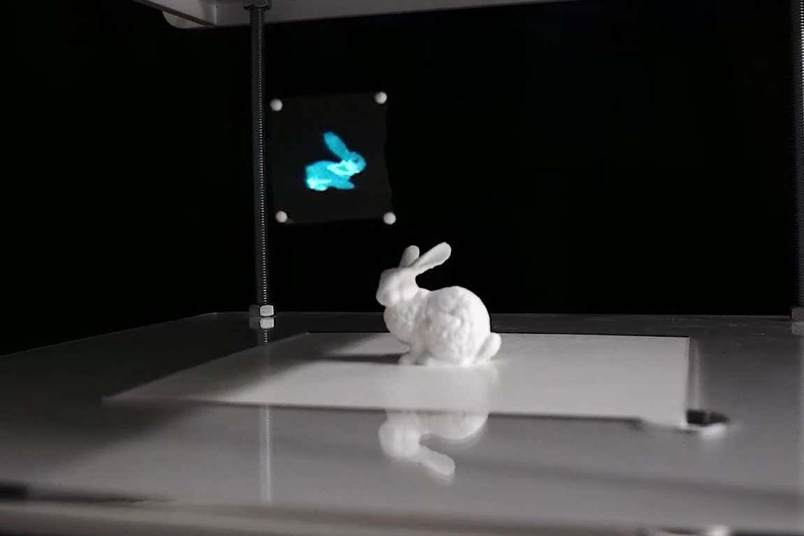 A rabbit hologram levitated above a 3D printed rabbit