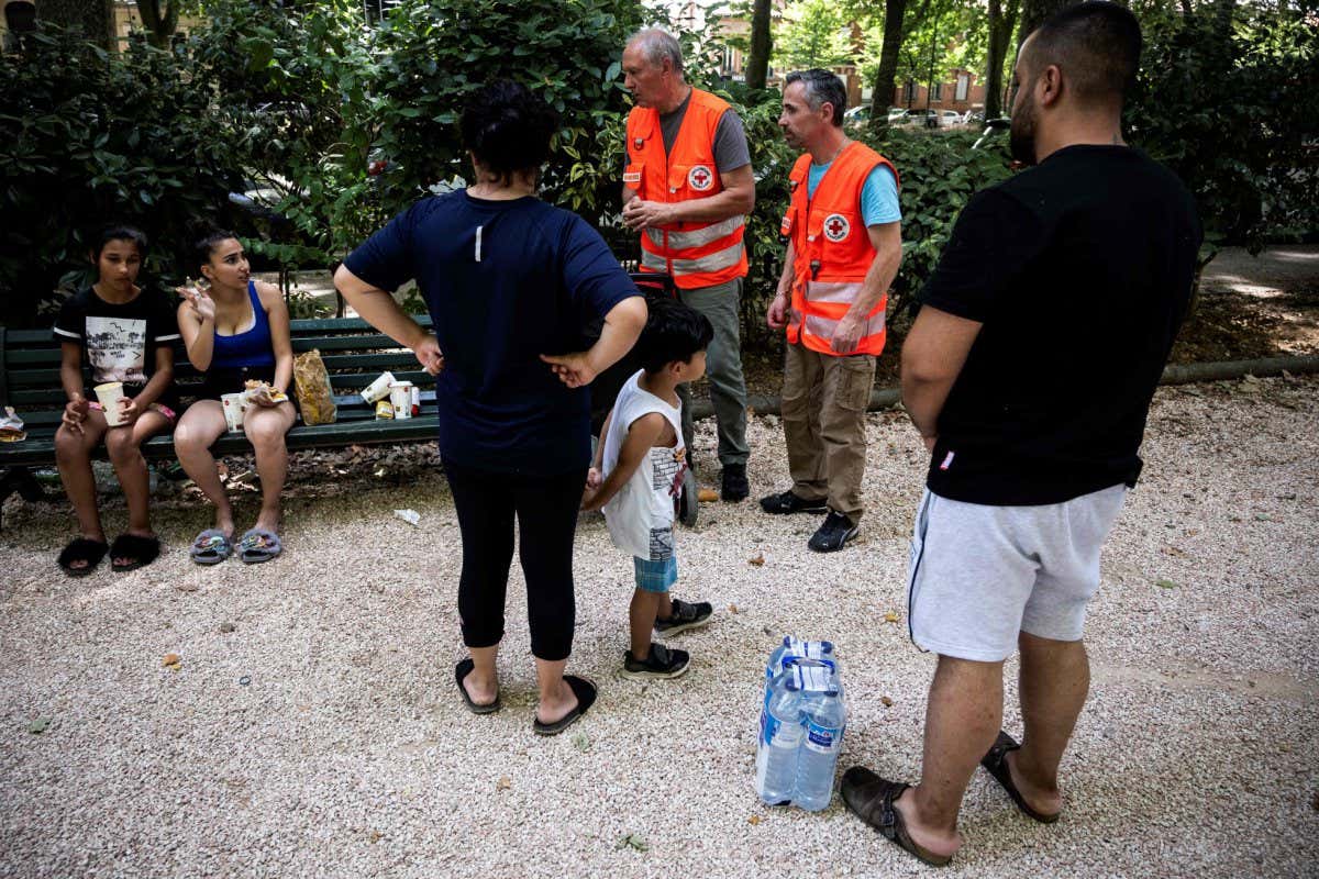 Red Cross workers distributing water