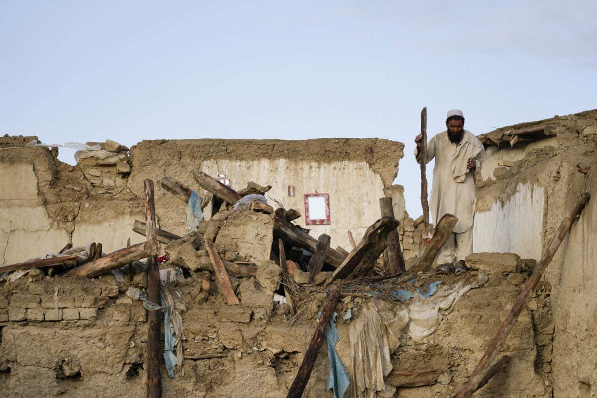 Mandatory Credit: Photo by Ebrahim Noroozi/AP/Shutterstock (12997162o) Man stands among destruction after an earthquake in Gayan village, in Paktika province, Afghanistan, . A powerful earthquake struck a rugged, mountainous region of eastern Afghanistan early Wednesday, flattening stone and mud-brick homes in the country's deadliest quake in two decades, the state-run news agency reported Earthquake, Gayan, Afghanistan - 23 Jun 2022