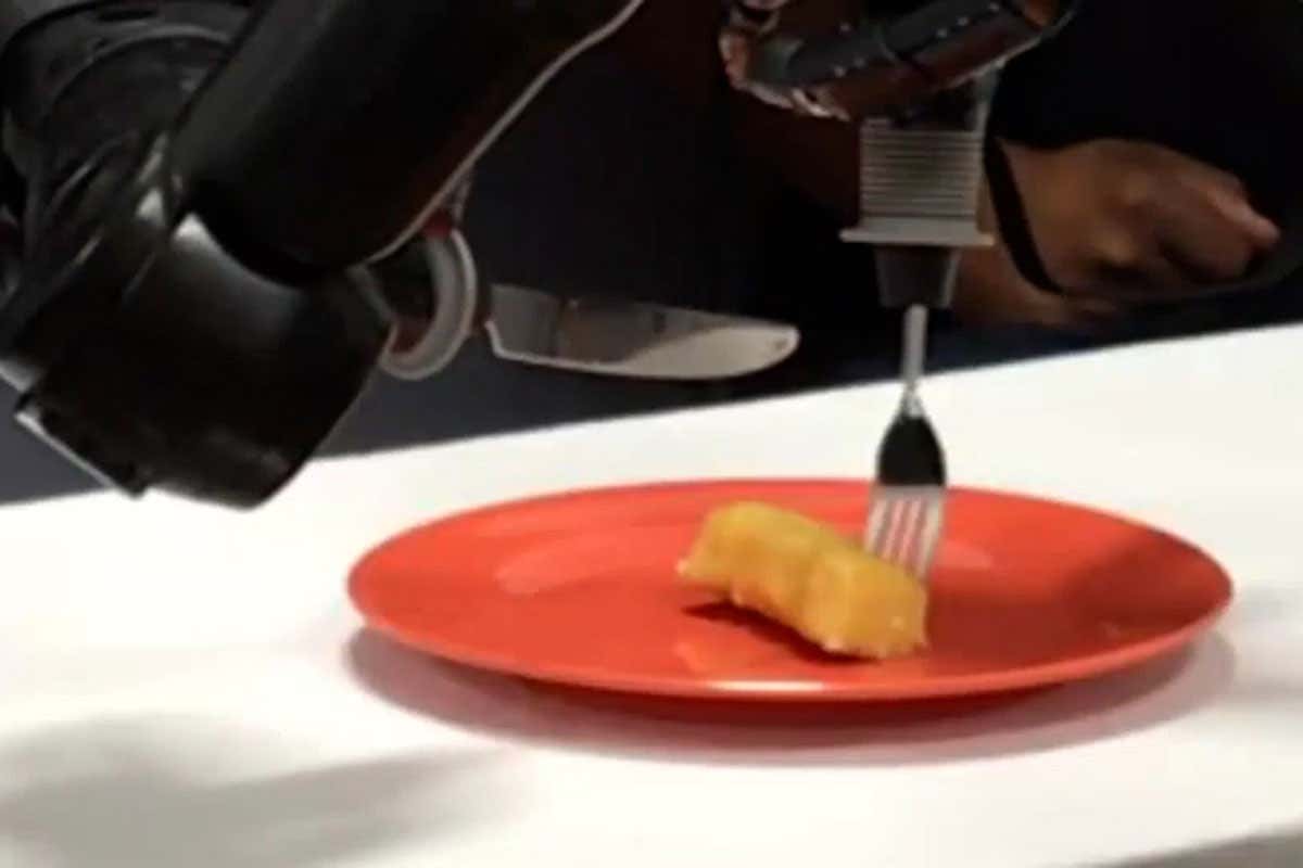 Paralysed man feeds himself dessert using his mind and smart robotic hands