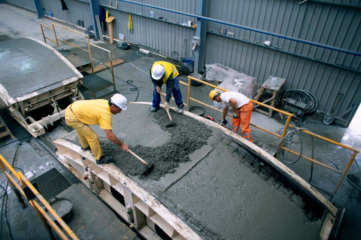 Engineers working with concrete