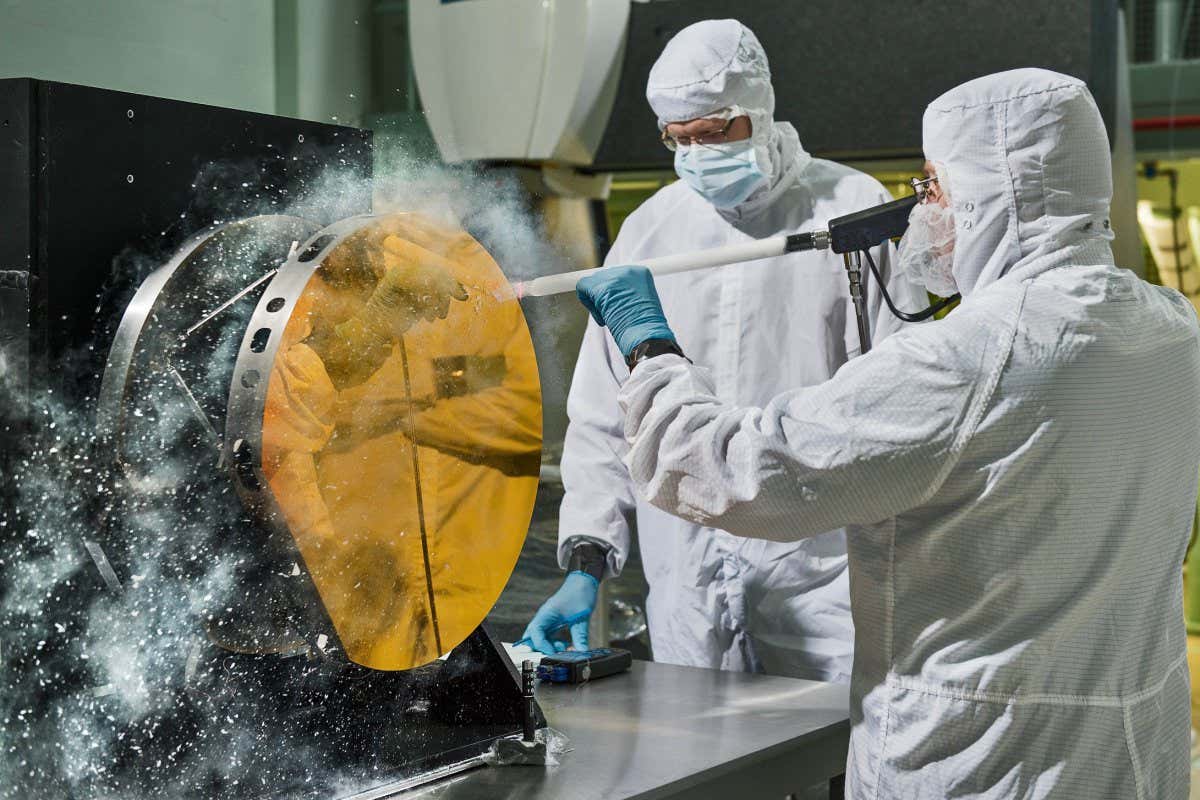 https://www.flickr.com/photos/nasawebbtelescope/17406589981/in/album-72157711864057113/ Engineers Clean Mirror with Carbon Dioxide Snow Just like drivers sometimes use snow to clean their car mirrors in winter, two Exelis Inc. engineers are practicing "snow cleaning'" on a test telescope mirror for the James Webb Space Telescope at NASA's Goddard Space Flight Center in Greenbelt, Maryland. By shooting carbon dioxide snow at the surface, engineers are able to clean large telescope mirrors without scratching them. "The snow-like crystals (carbon dioxide snow) knock contaminate particulates and molecules off the mirror," said Lee Feinberg, NASA optical telescope element manager. This technique will only be used if the James Webb Space Telescope's mirror is contaminated during integration and testing. The Webb telescope is the scientific successor to NASA's Hubble Space Telescope. It will be the most powerful space telescope ever built. With a mirror seven times as large as Hubble's and infrared capability, Webb will be capturing light from 13.5 billion light years away. To do this, its mirror must be kept super clean. "Small dust particles or molecules can impact the science that can be done with the Webb," said Feinberg. "So cleanliness especially on the mirrors is critical." Webb is an international project led by NASA with its partners, the European Space Agency and the Canadian Space Agency.