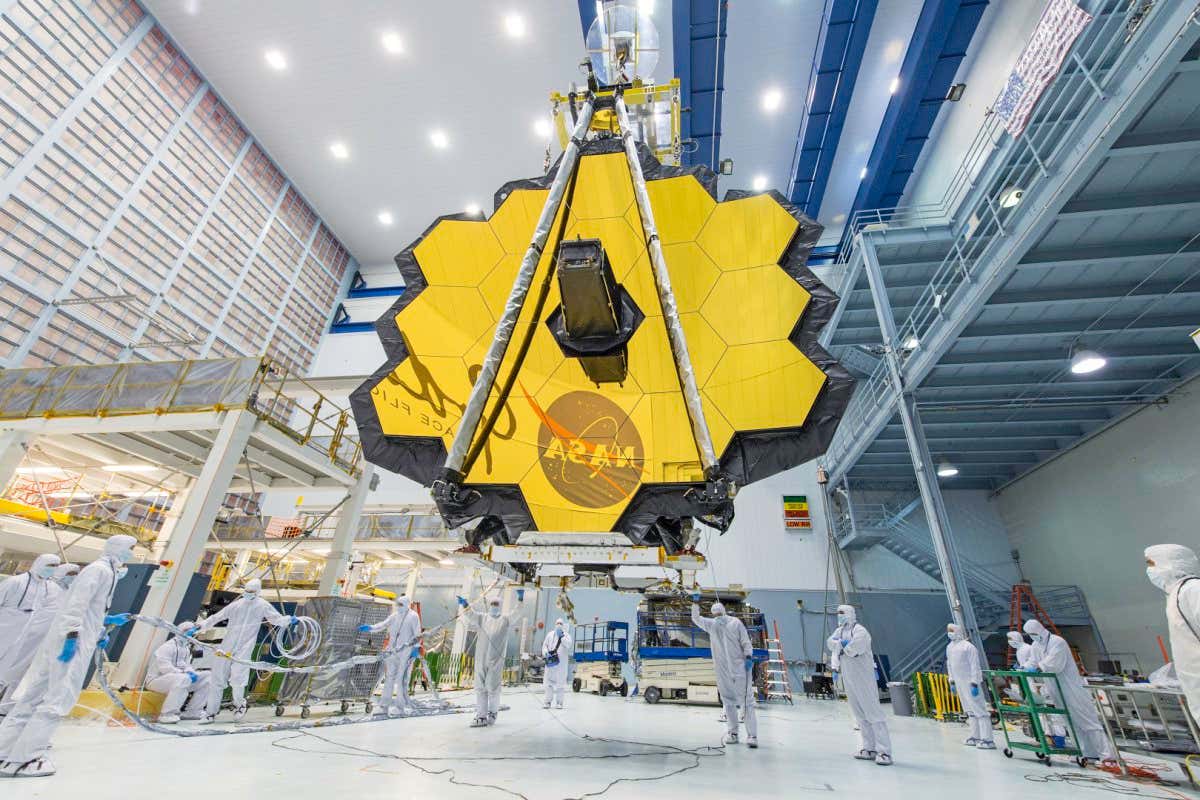 https://www.flickr.com/photos/nasawebbtelescope/33433274343/in/album-72157629134274763/ James Webb Space Telescope Mirror Seen in Full Bloom It's springtime and the deployed primary mirror of NASA's James Webb Space Telescope looks like a spring flower in full bloom. In this photo, NASA technicians lifted the telescope using a crane and moved it inside a clean room at NASA?s Goddard Space Flight Center in Greenbelt, Maryland. Once launched into space, the Webb telescope?s 18-segmented gold mirror is specially designed to capture infrared light from the first galaxies that formed in the early Universe, and will help the telescope peer inside dust clouds where stars and planetary systems are forming today. The James Webb Space Telescope is the scientific successor to NASA's Hubble Space Telescope. It will be the most powerful space telescope ever built. Webb is an international project led by NASA with its partners, ESA (European Space Agency) and the Canadian Space Agency.