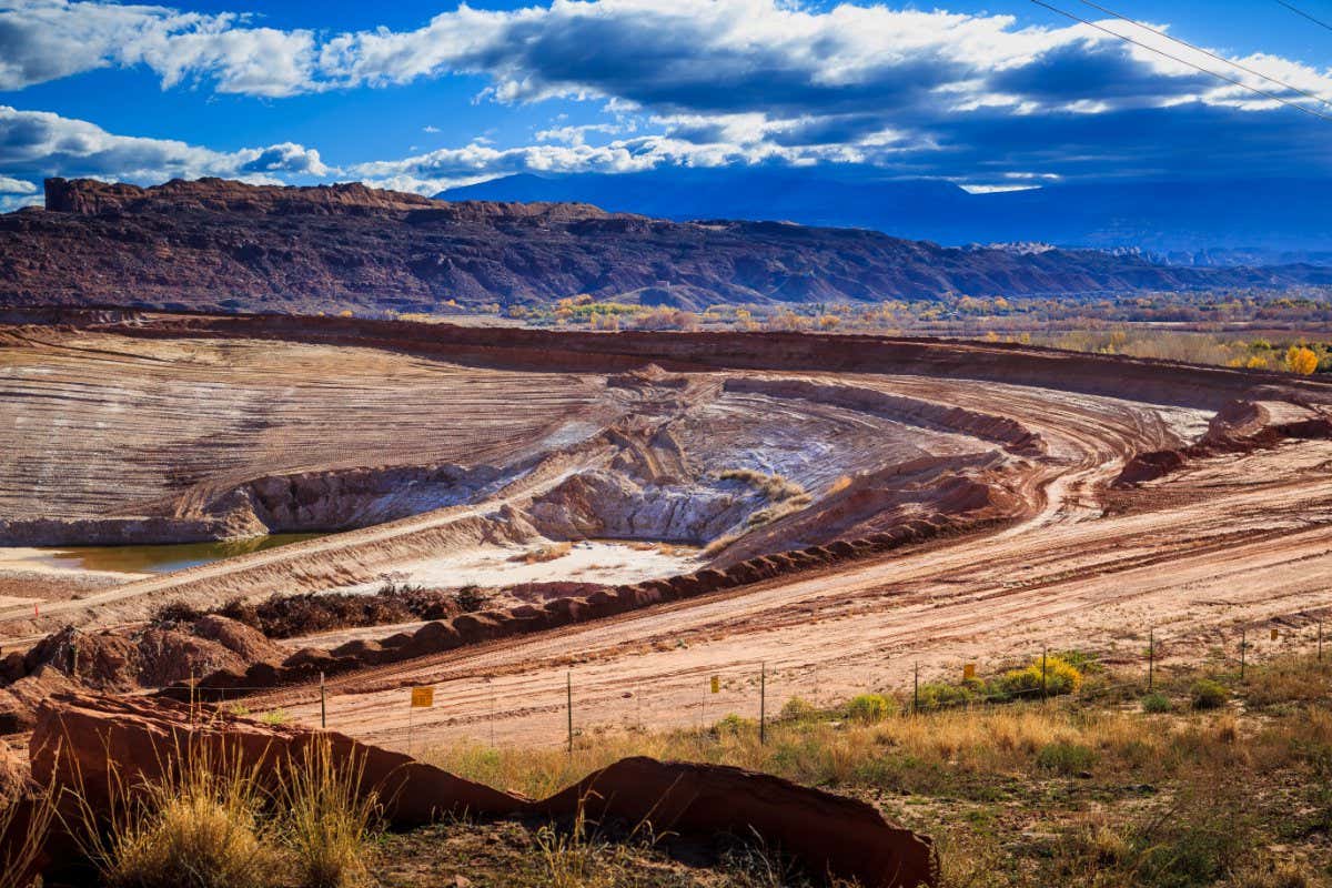 Heavy machinery removes soil that is laced with pollutant chemicals for disposal