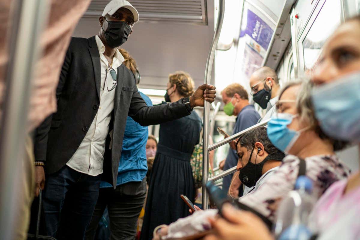 NEW YORK, NY - JUNE 08: Passengers wear masks at the subway during rush hour on June 08, 2021 in New York City. New York City's subways are now operating 24-7 as Covid-19 cases have dropped and more Americans receive the vaccination for Covid-19. (Photo by Robert Nickelsberg/Getty Images)