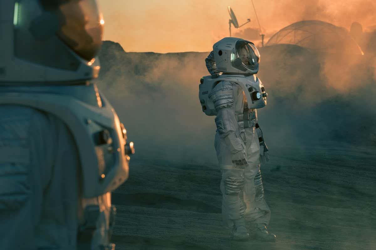 Two Astronauts wearing Space Suits Standing on Alien Planet and Looking at Something. Futuristic Space Exploration, Discovery and Colonization.