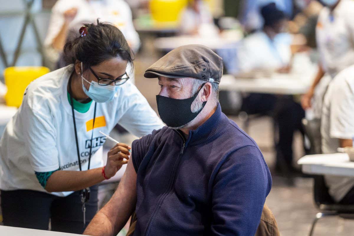 A person is vaccinated against covid-19 at Wembley Stadium in London, the UK, in December 2021