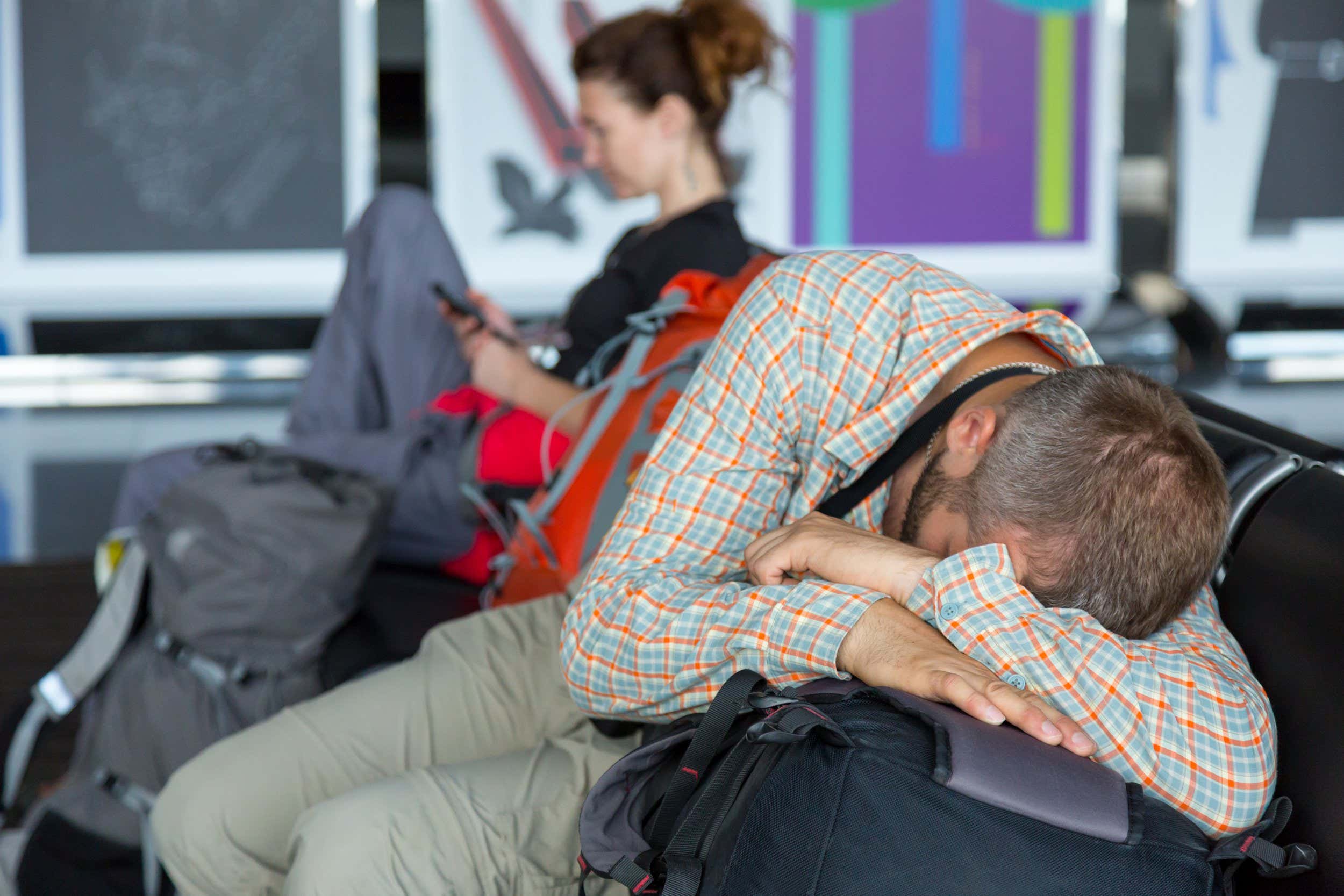Passengers waiting for the air flight at airport terminal.