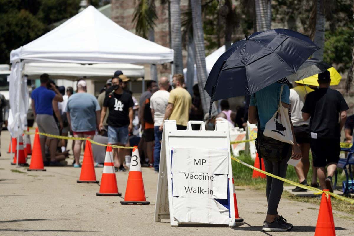People queue at a monkeypox vaccination site in Encino, LA in California, in July