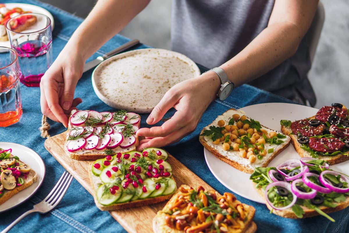 Woman arranging vegetarian buffet