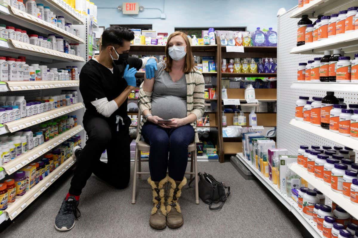 A pregnant person receives the Pfizer/BioNTech vaccine against covid-19 in Schwenksville, Pennsylvania in February 2021