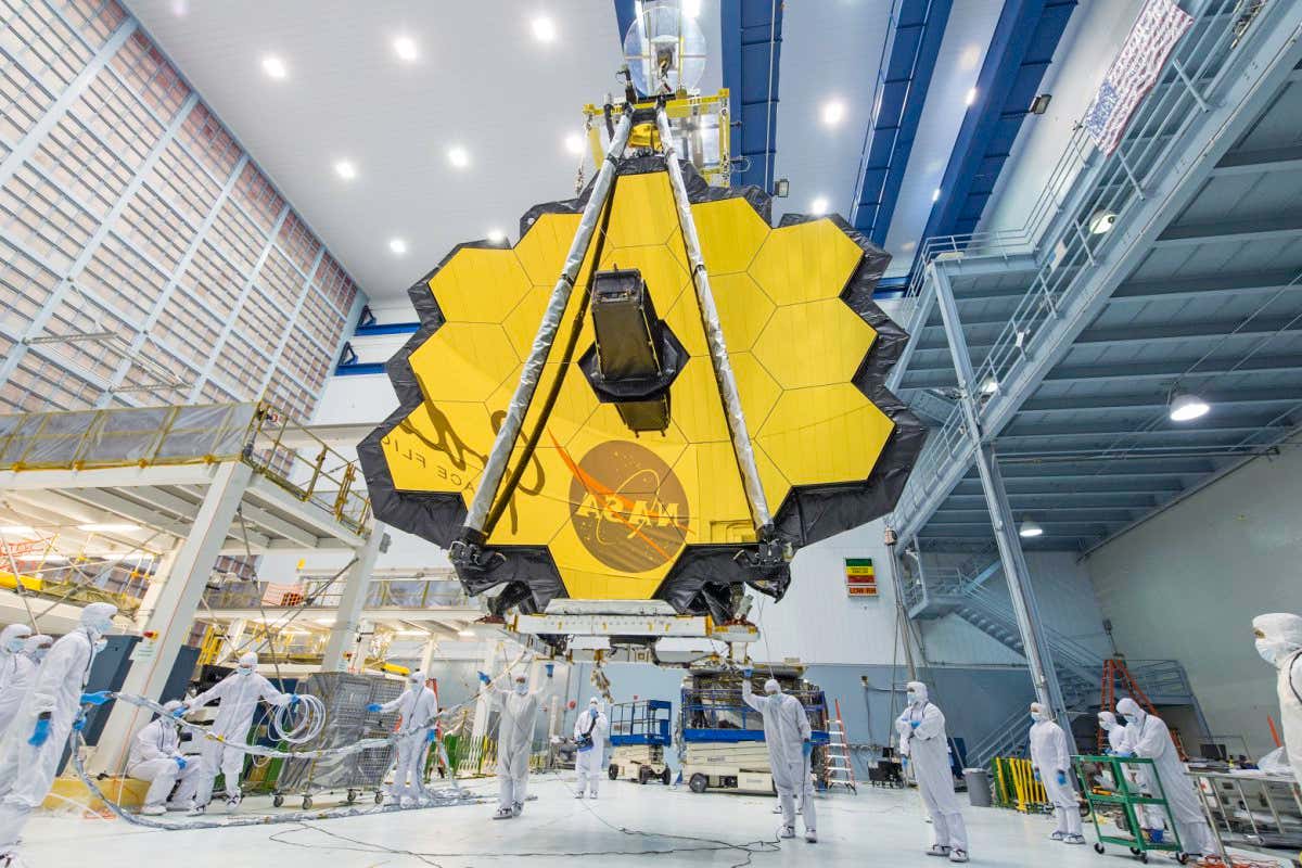 It's springtime and the deployed primary mirror of NASA's James Webb Space Telescope looks like a spring flower in full bloom. In this photo, NASA technicians lifted the telescope using a crane and moved it inside a clean room at NASA?s Goddard Space Flight Center in Greenbelt, Maryland. Once launched into space, the Webb telescope?s 18-segmented gold mirror is specially designed to capture infrared light from the first galaxies that formed in the early universe, and will help the telescope peer inside dust clouds where stars and planetary systems are forming today. The James Webb Space Telescope is the scientific successor to NASA's Hubble Space Telescope. It will be the most powerful space telescope ever built. Webb is an international project led by NASA with its partners, ESA (European Space Agency) and the Canadian Space Agency.