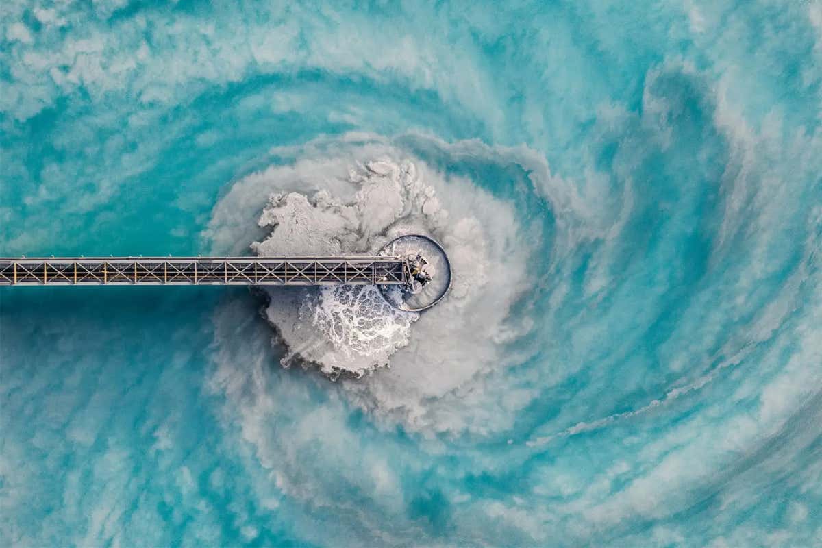 Aerial image showing swirling water patterns at a waste management facility, Arizona, United States of America
