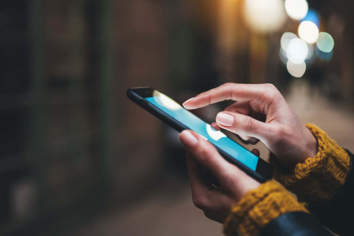 Someone pointing on a phone