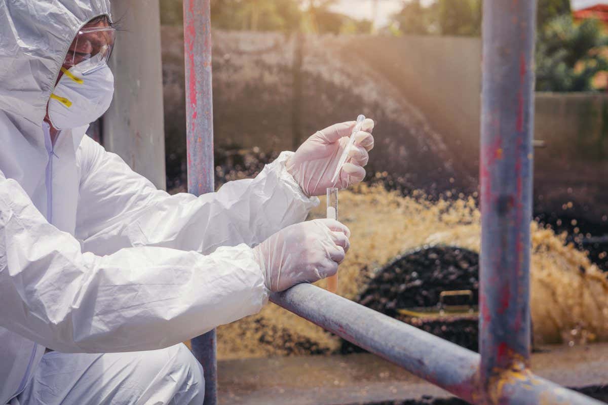 Scientists hands experimenting with water quality at wastewater treatment system. select focus; Shutterstock ID 1520973440; purchase_order: -; job: -; client: -; other: -