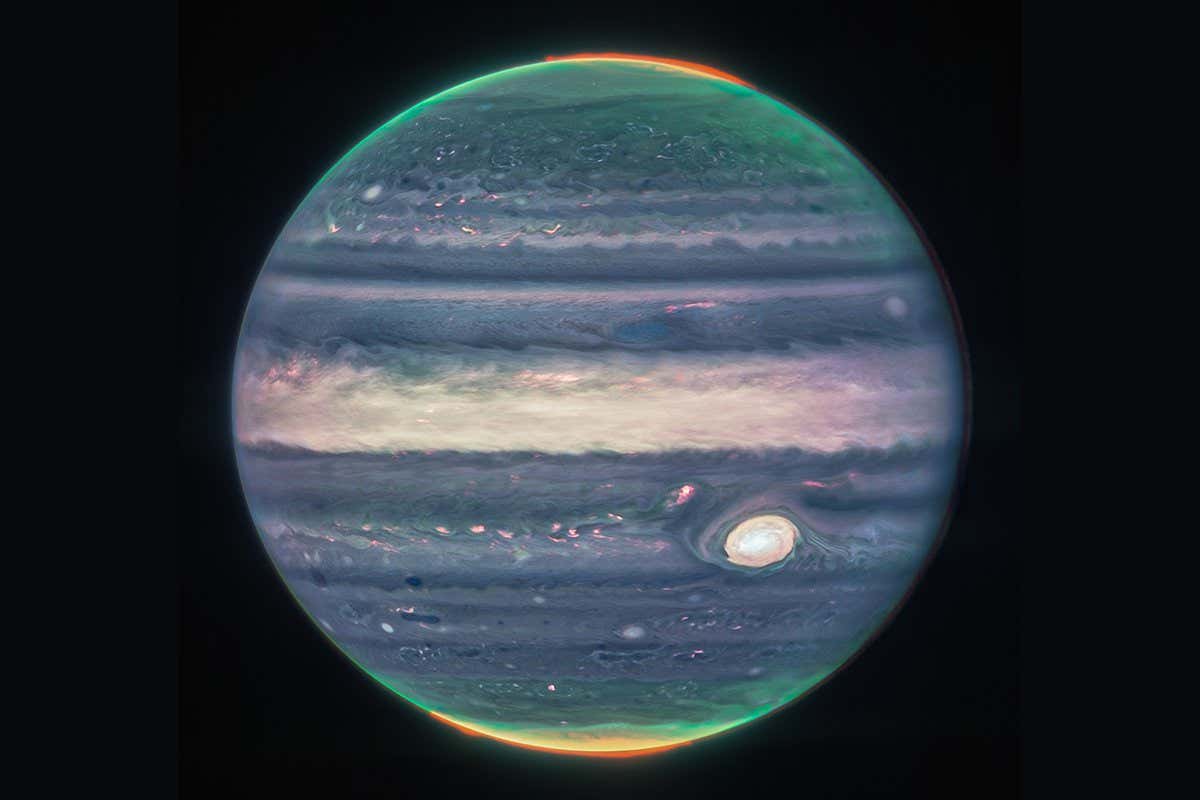 Webb NIRCam composite image of Jupiter from three filters ? F360M (red), F212N (yellow-green), and F150W2 (cyan) ? and alignment due to the planet's rotation.