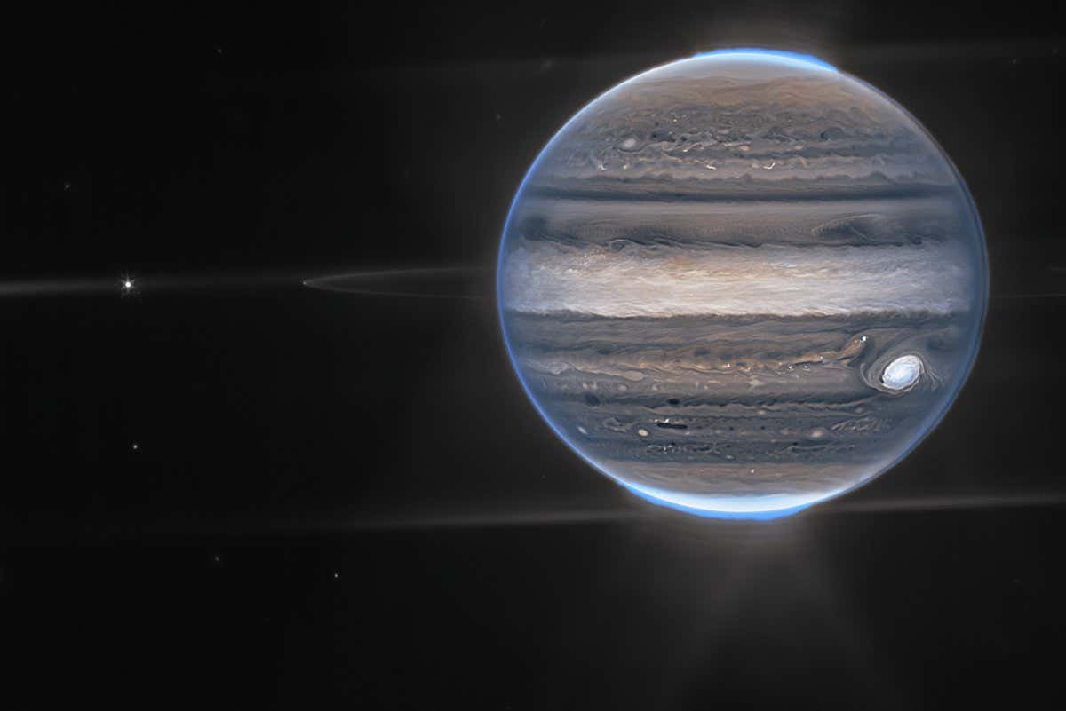 Webb NIRCam composite image from two filters ? F212N (orange) and F335M (cyan) ? of Jupiter system, unlabeled (top) and labeled (bottom).