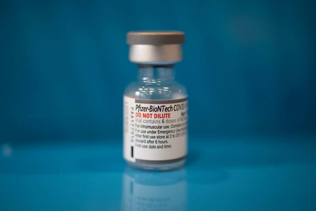 A vial of the Pfizer-BioNTech Covid-19 vaccine at a clinic inside Trinity Evangelic Lutheran Church in Lansdale, Pennsylvania, U.S, on Tuesday, Apr. 5, 2022. U.S. regulators cleared second booster??doses??of Covid-19 vaccine from??Moderna Inc.??and the partnership of??Pfizer Inc.??and??BioNTech SE for adults 50 and older, making millions more people eligible for the shots as concern grows about a potential new wave of infections. Photographer: Hannah Beier/Bloomberg via Getty Images
