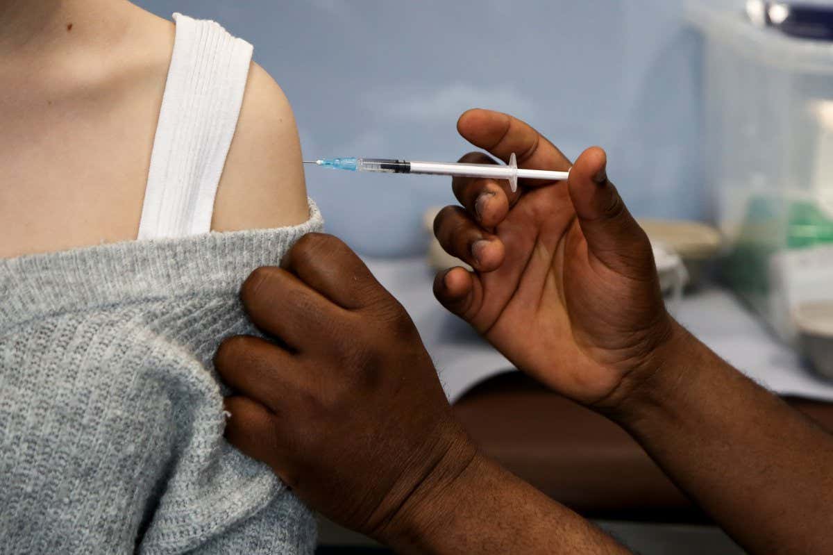 Health worker giving a vaccine