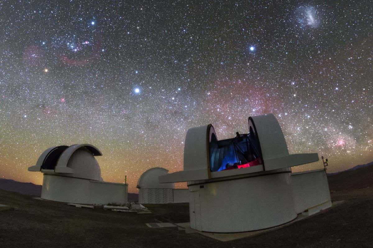The telescopes of the SPECULOOS Southern Observatory gaze out into the stunning night sky over the Atacama desert in Chile