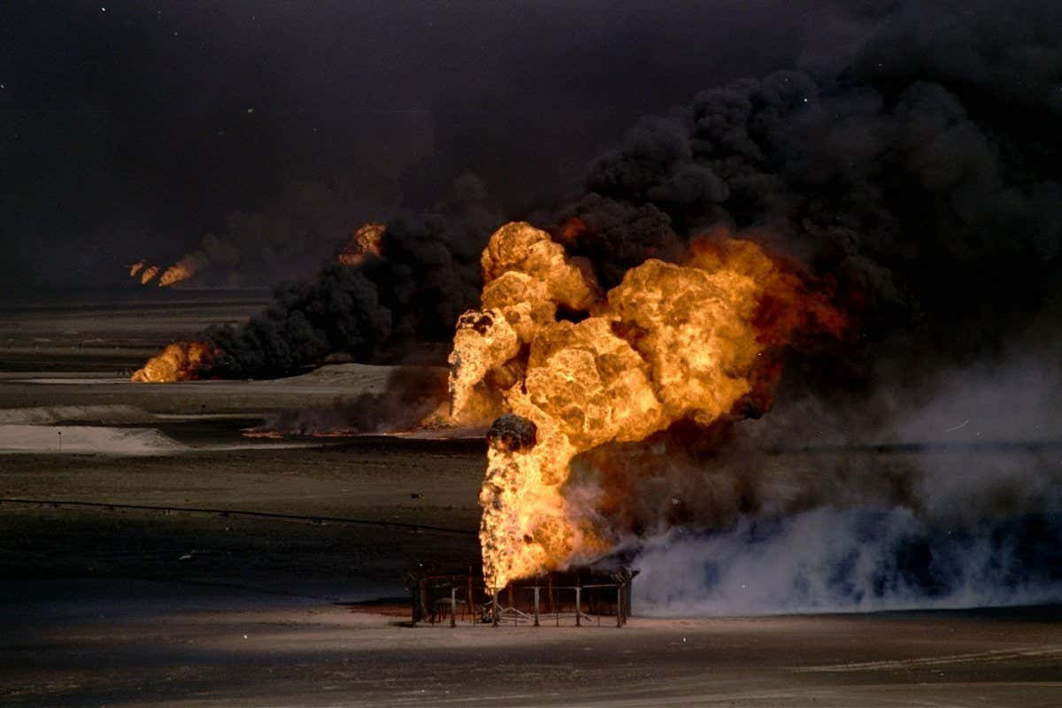Geysers of flame and thick, toxic smoke spew forth from just a few of the hundreds of Kuwaiti oil wells set afire by fleeing Iraqi troops. With 80 to 85 percent of Kuwait's oil production destroyed, putting the fires out is the country's top priority as it recovers from the Iraqi occupation GULF WAR, KUWAIT CITY, Kuwait