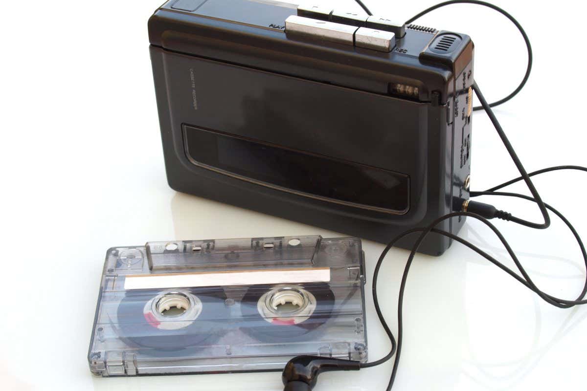 vintage music cassette tape and walkman recorder over white white background; Shutterstock ID 1062342512; purchase_order: -; job: -; client: -; other: -
