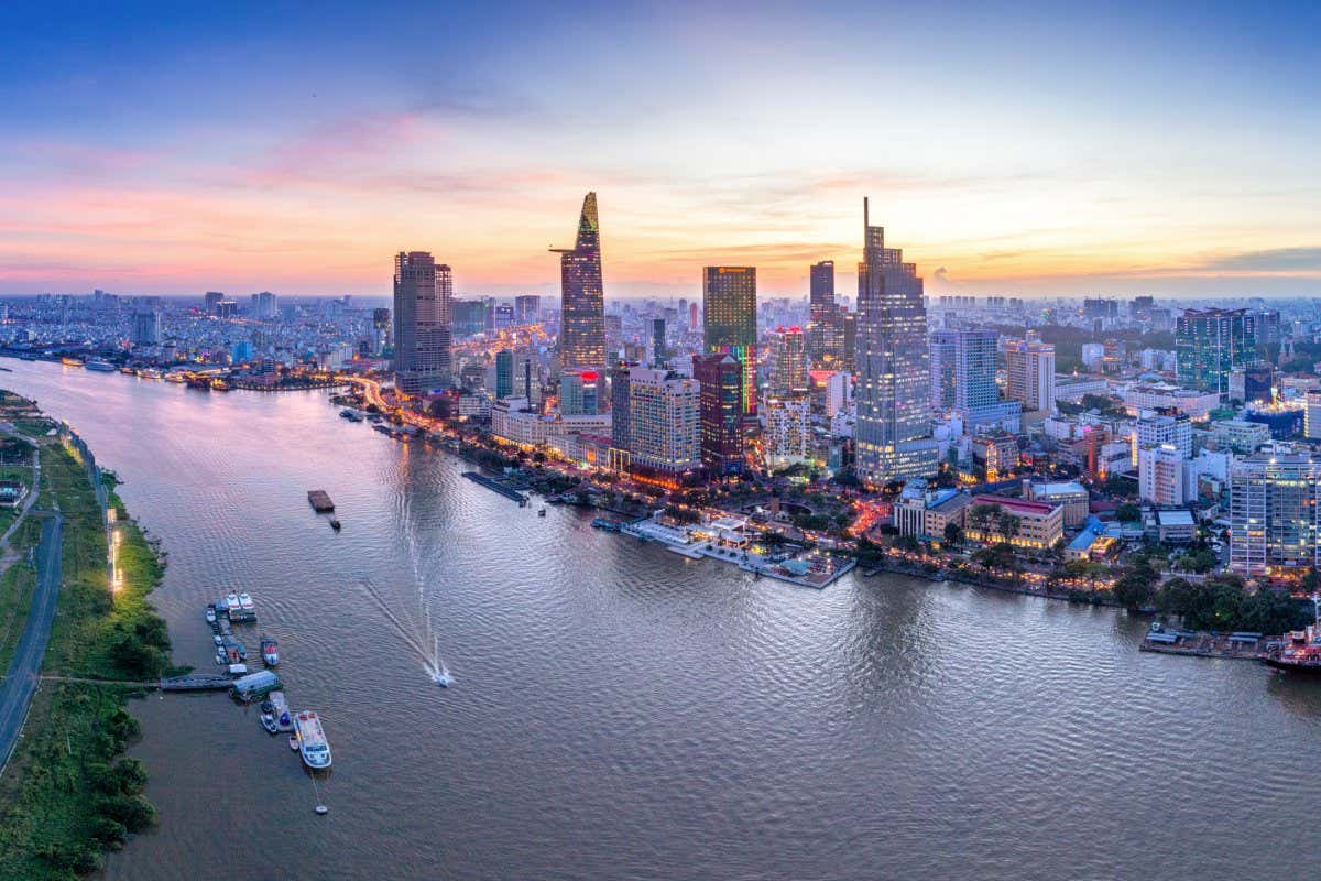 HO CHI MINH, VIETNAM - NOV 20, 2017: Royalty high quality stock image aerial view of Ho Chi Minh city, Vietnam. Beauty skyscrapers along river light smooth down urban development in Ho Chi Minh City; Shutterstock ID 759434539; purchase_order: -; job: -; client: -; other: -