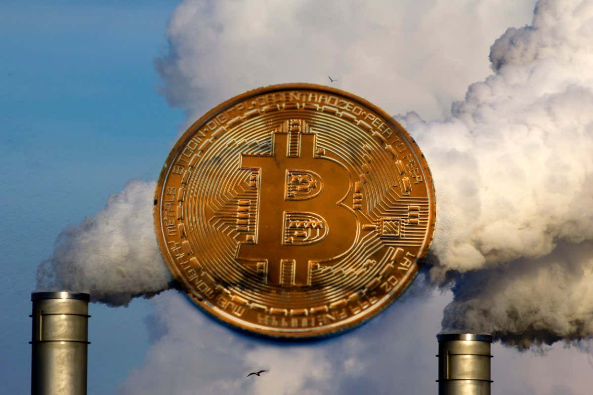Image of a bitcoin in a cloud of emissions