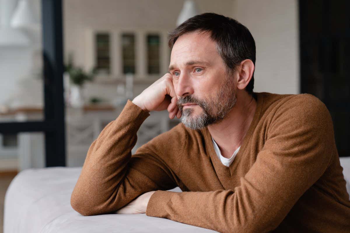 Bored tired sad mature middle-aged man depressed lonely having no visitors of his children. Divorce , bachelor , health problems concept. Lockdown, unemployment, needless man on social distance; Shutterstock ID 2005053044; purchase_order: -; job: -; client: -; other: -