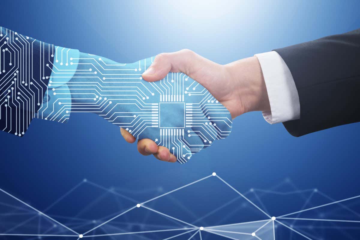 Image of a businessman shaking hands with a digital hand
