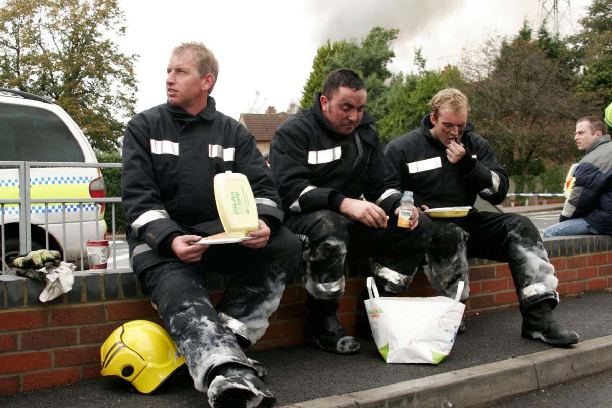 ANRTR4 Firemen on duty stopping for takeaway lunch