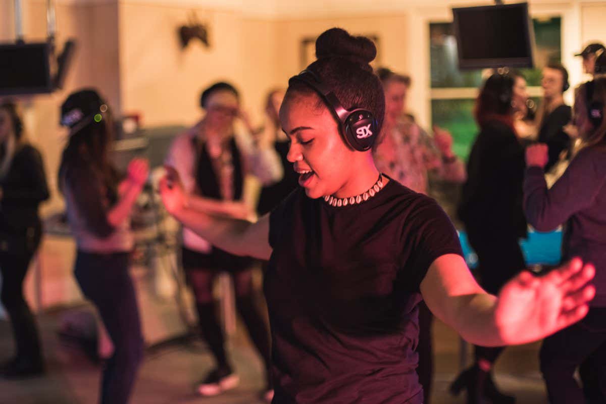 Woman dancing with headphones