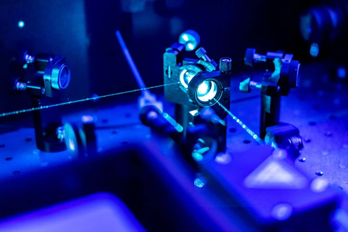laser reflect on optic table un quantum laboratory; Shutterstock ID 1308974998; purchase_order: -; job: -; client: -; other: -